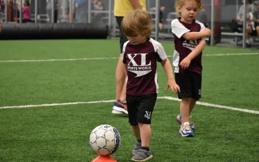 kids playing football on a field