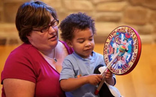a person and a child painting