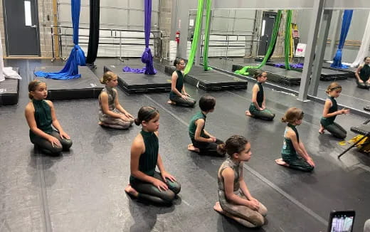 a group of people sitting on the floor