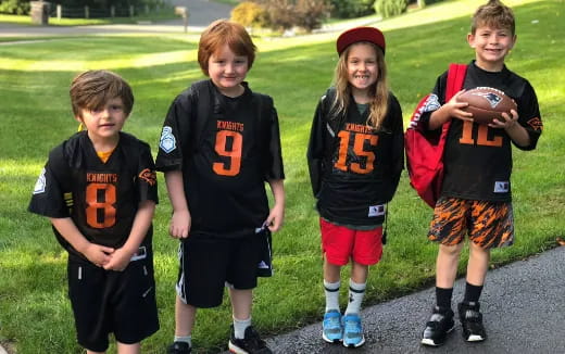 a group of kids wearing football uniforms