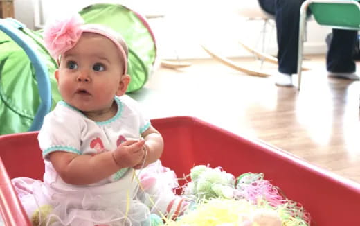 a baby sitting at a table