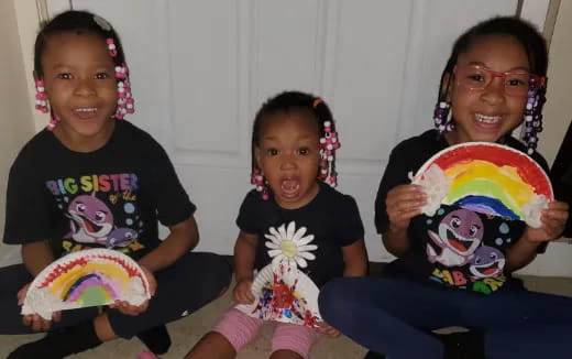 a group of children holding plates