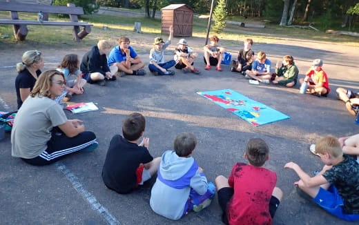 a group of people sitting on the ground