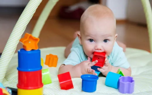 a baby playing with toys