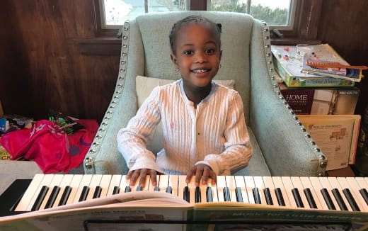 a child playing a piano