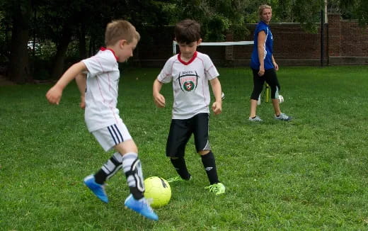 kids playing football on a field