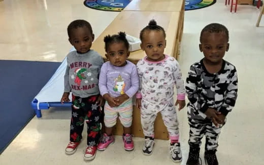 a group of children posing for a photo