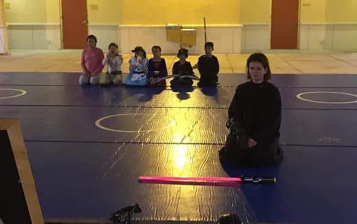 a group of people sitting on the floor