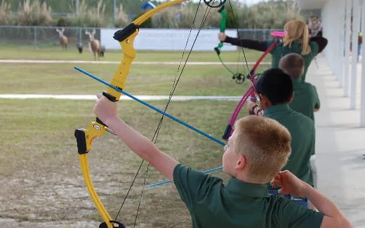 a group of people playing with a hula hoop