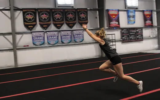 a woman running on a track