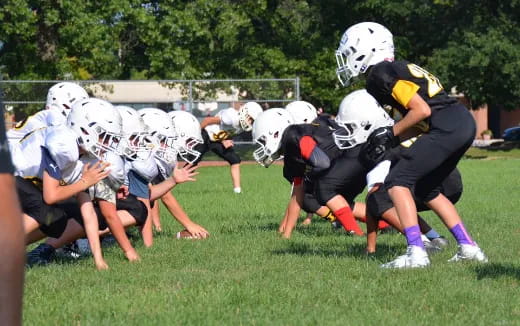 a group of people playing football