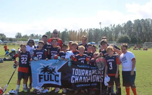 a group of people holding a sign