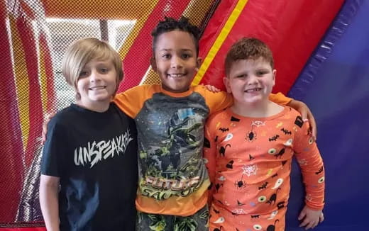 a group of kids posing for a photo