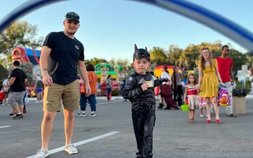 a person and a boy posing for a picture