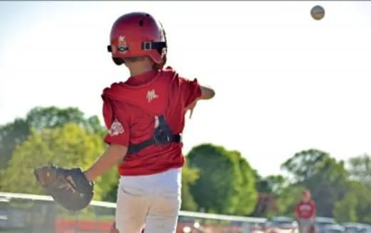 a young boy throwing a baseball