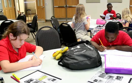 a group of people sitting at a table