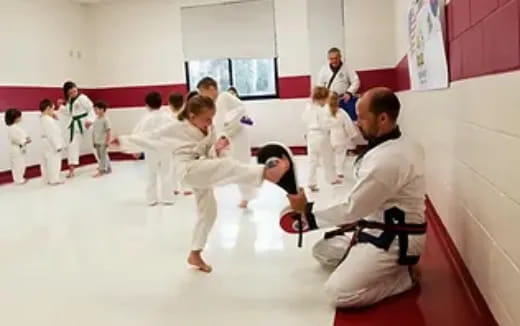 a group of people in karate uniforms