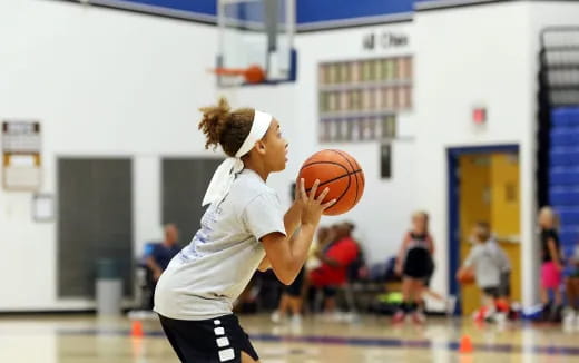 a girl playing basketball