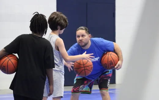 a person holding a basketball