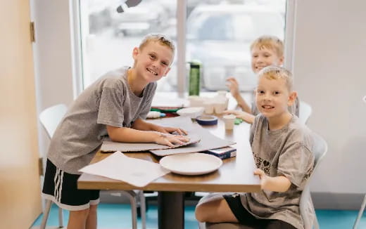 a group of people sitting at a table