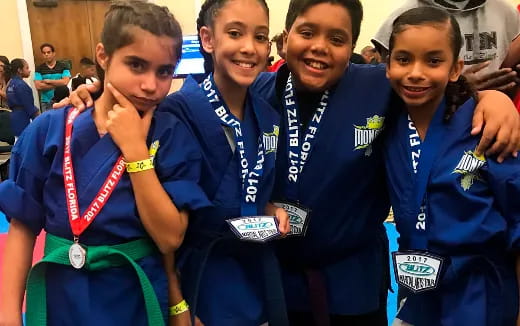 a group of people wearing medals