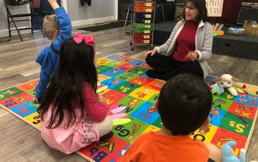 a group of children sitting on the floor