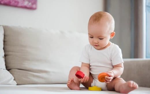 a baby playing with toys