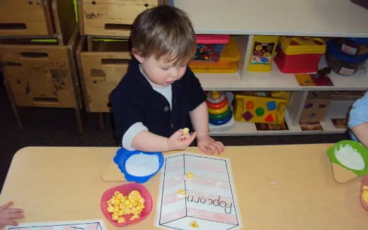 a child sitting at a table