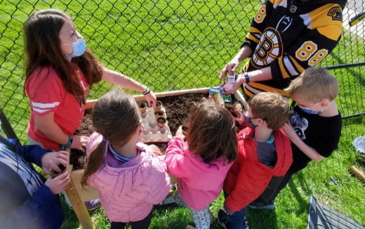 a group of children playing with a toy