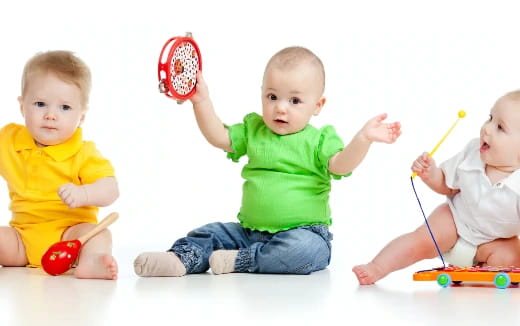 babies playing with toys