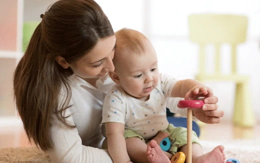 a person holding a baby