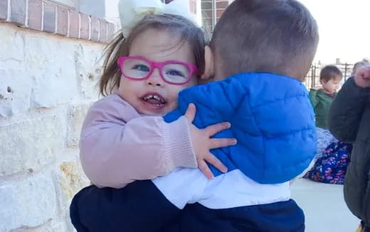 a person holding a baby