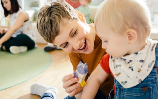 a couple of children playing with toys