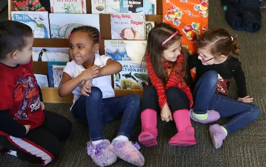 a group of children sitting on the floor