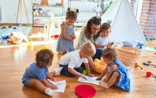 a group of children sitting on the floor
