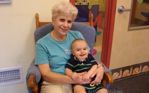 a person holding a baby