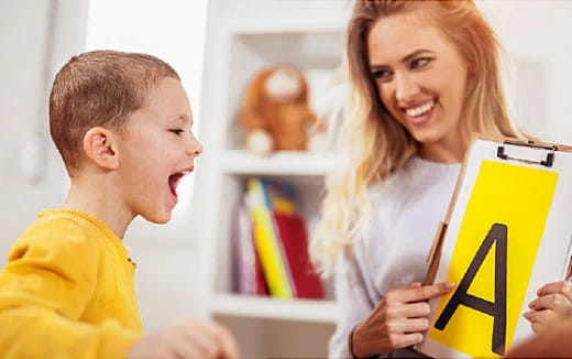 a person and a child looking at a book