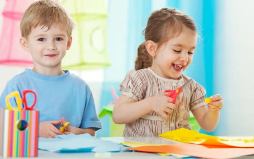 a couple of children playing with toys