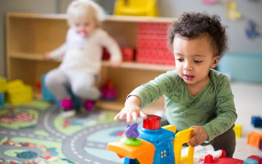 a baby playing with toys