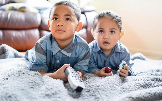 two boys playing with toys