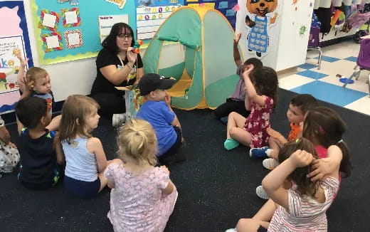 a person teaching children in a classroom