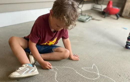 a child playing with sand