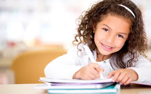 a young girl using a tablet