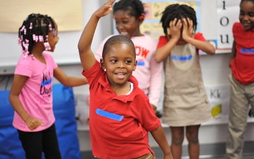 a group of children in a classroom