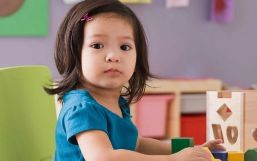 a girl sitting in a chair
