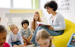 a teacher reading to her students