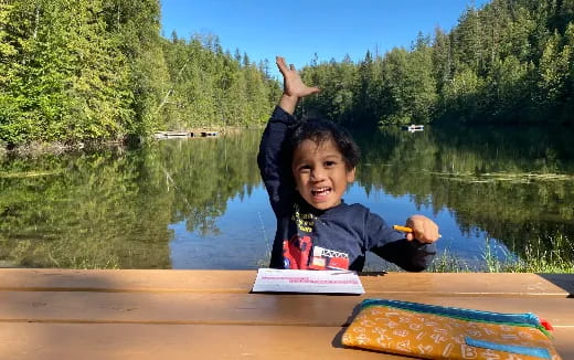 a boy sitting in a boat