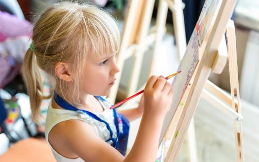 a young girl painting