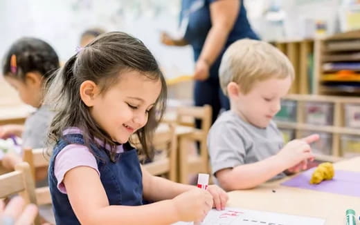 a few children sitting at a table