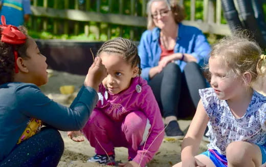 a group of people sitting on the ground